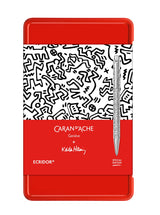קופסת מתנה של עט כדורי יוקרתי אקרידור ונרתיק עור מהדורה מיוחדת של קית' הרינג וקראנדש | CARAN D’ACHE + KEITH HARING